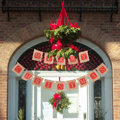 Brown and red burlap Christmas banner with fourteen flags on a string for wall decoration.