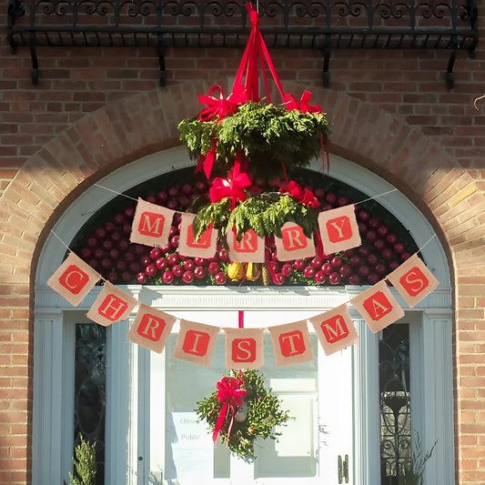 Brown and red burlap Christmas banner with fourteen flags on a string for wall decoration.