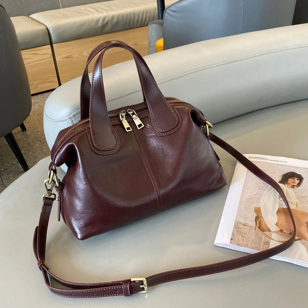 Soft pillow-shaped top grain leather handbag, 30cm x 13cm x 22cm, with double straps and inner patch pocket