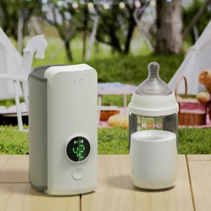 Grey non-woven portable baby bottle warmer with USB charging cable showing wrap-around design for universal bottle fit