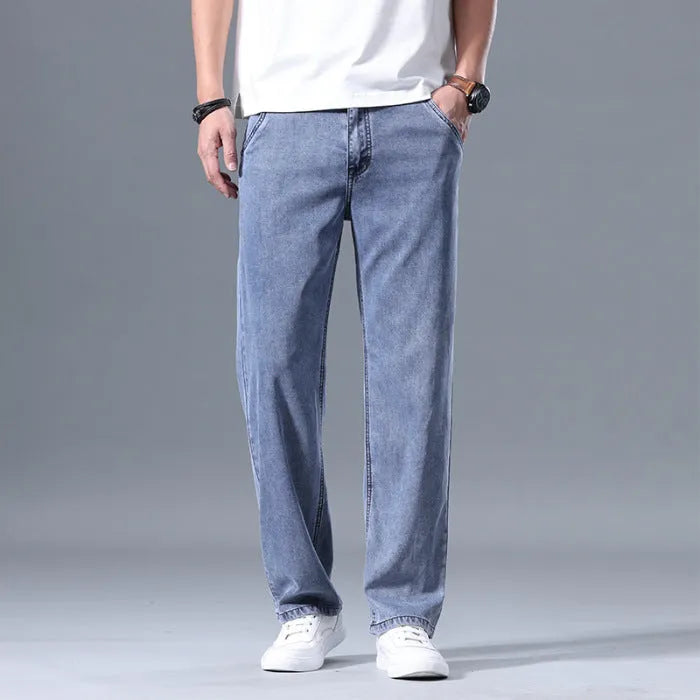 Man wearing light blue loose-fit straight-leg lyocell blend casual jeans.