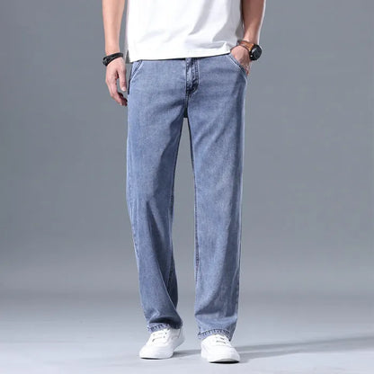 Man wearing light blue loose-fit straight-leg lyocell blend casual jeans.