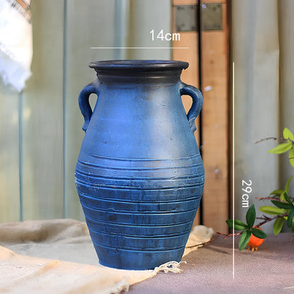 Ceramic mosaic vase with dried flowers, showing mosaic pattern and 25cm height