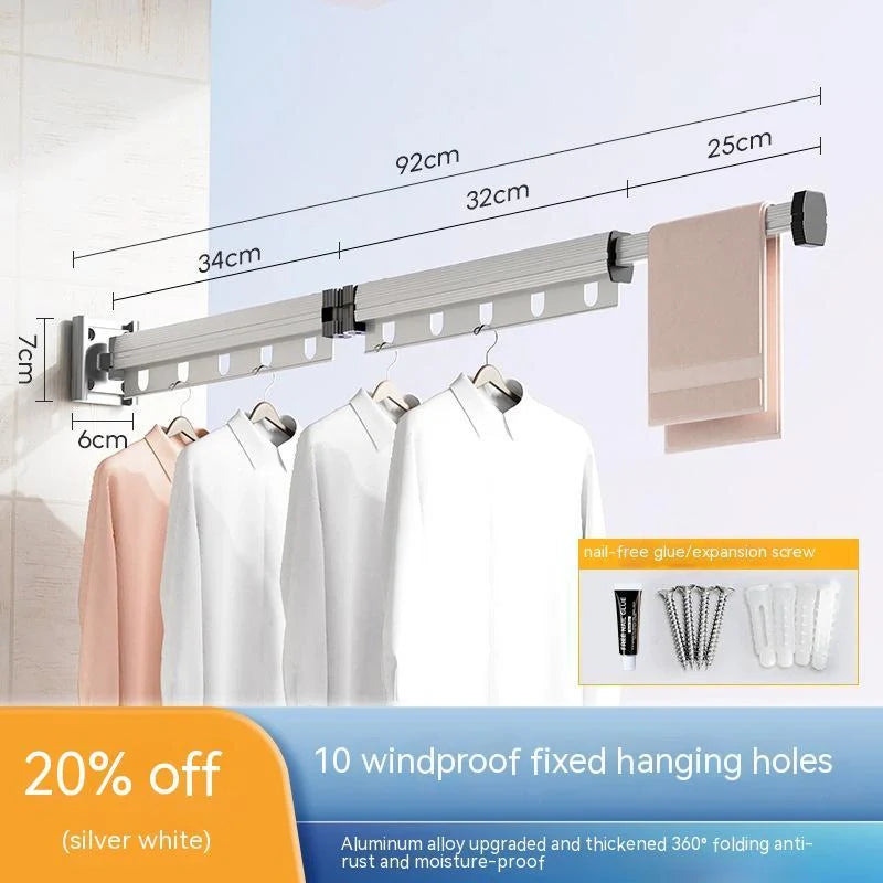 Aluminum retractable drying rack mounted on a window, extending outward for clothes drying