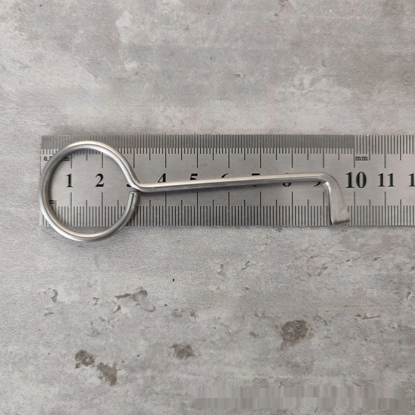 Two silver alloy wrench tools from a portable universal family set on a plain background.