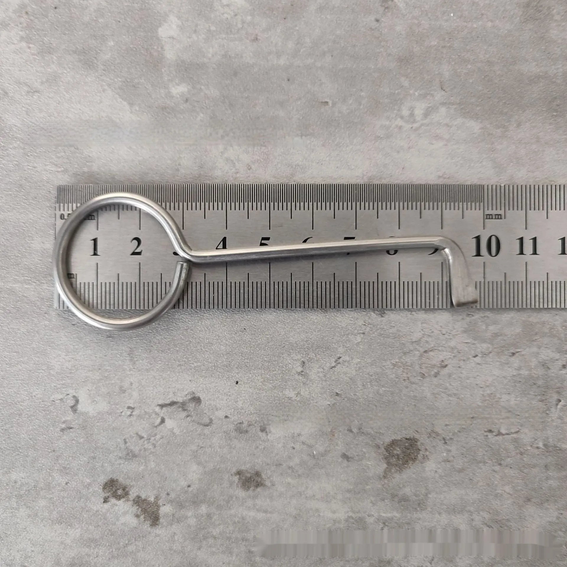 Two silver alloy wrench tools from a portable universal family set on a plain background.