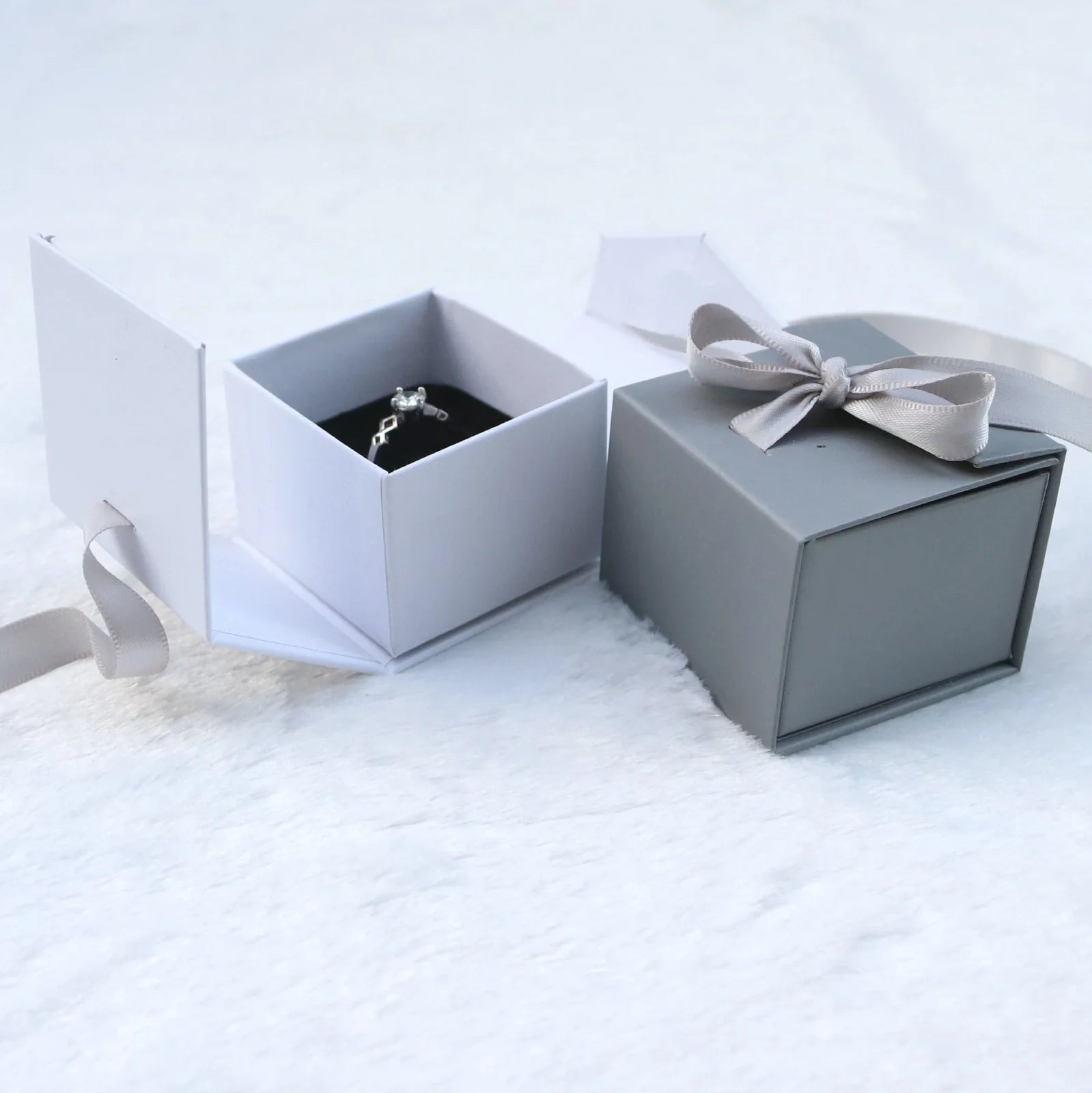 Square grey jewellery gift box with ribbon bow measuring 5x5cm for ring and earring storage