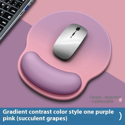 Silicone mouse mat with wristband in a gradient blue black colour pattern on a desk.