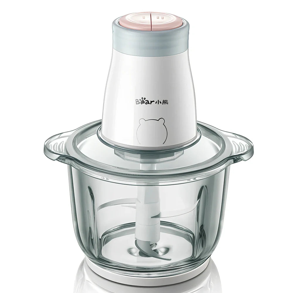 Household electric vegetable chopper blender with glass bowl and stainless steel blade on kitchen counter