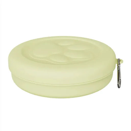 Collapsible silicone dog bowl with integrated snack compartment in light pink colour