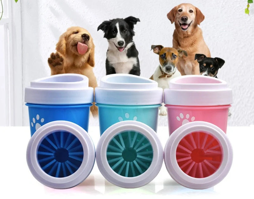 Silicone dog paw cleaner cup in blue, green, or pink with soft bristles for washing muddy paws