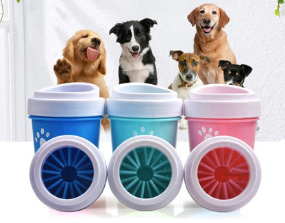 Silicone dog paw cleaner cup in blue, green, or pink with soft bristles for washing muddy paws