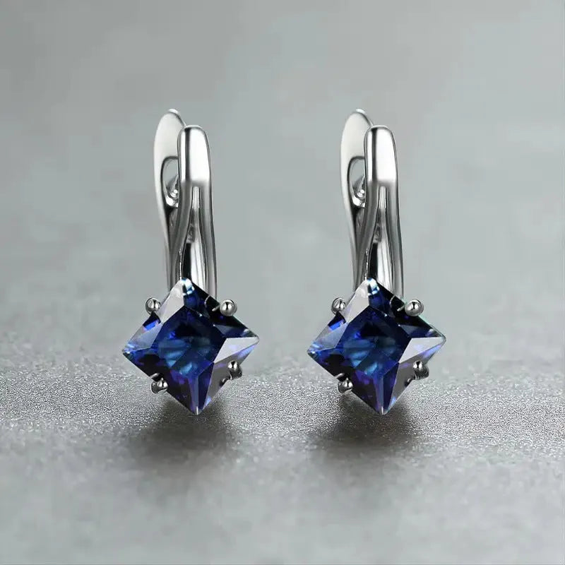 Diamond design earrings with inlaid zircon stones in copper, showing light luxury style for women in blue, green, and colour options.