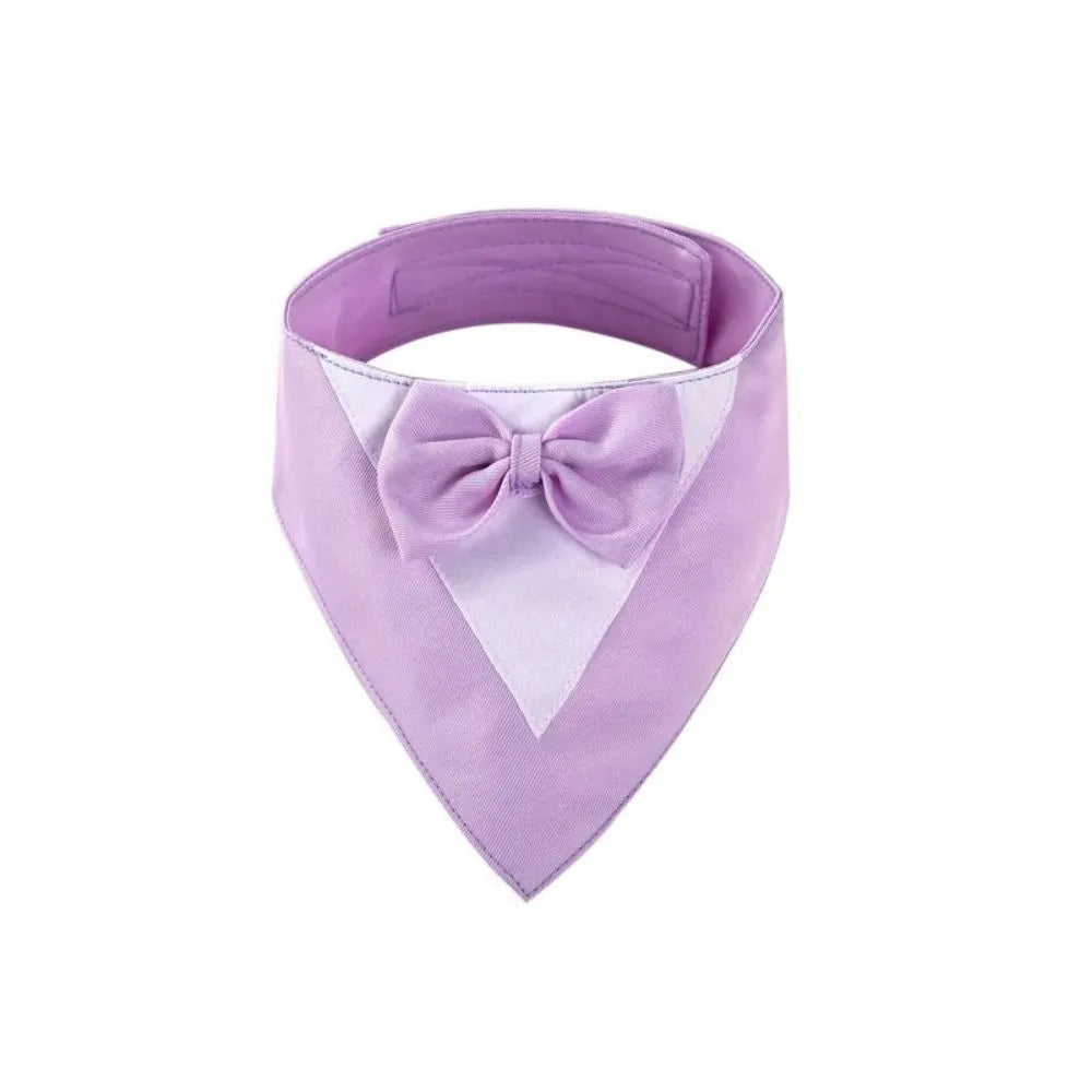 Triangle-shaped pet bib scarf with a bow, shown in a bright colour, displaying the soft fabric and absorbent towelling lining.