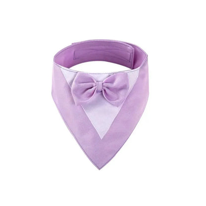 Triangle-shaped pet bib scarf with a bow, shown in a bright colour, displaying the soft fabric and absorbent towelling lining.