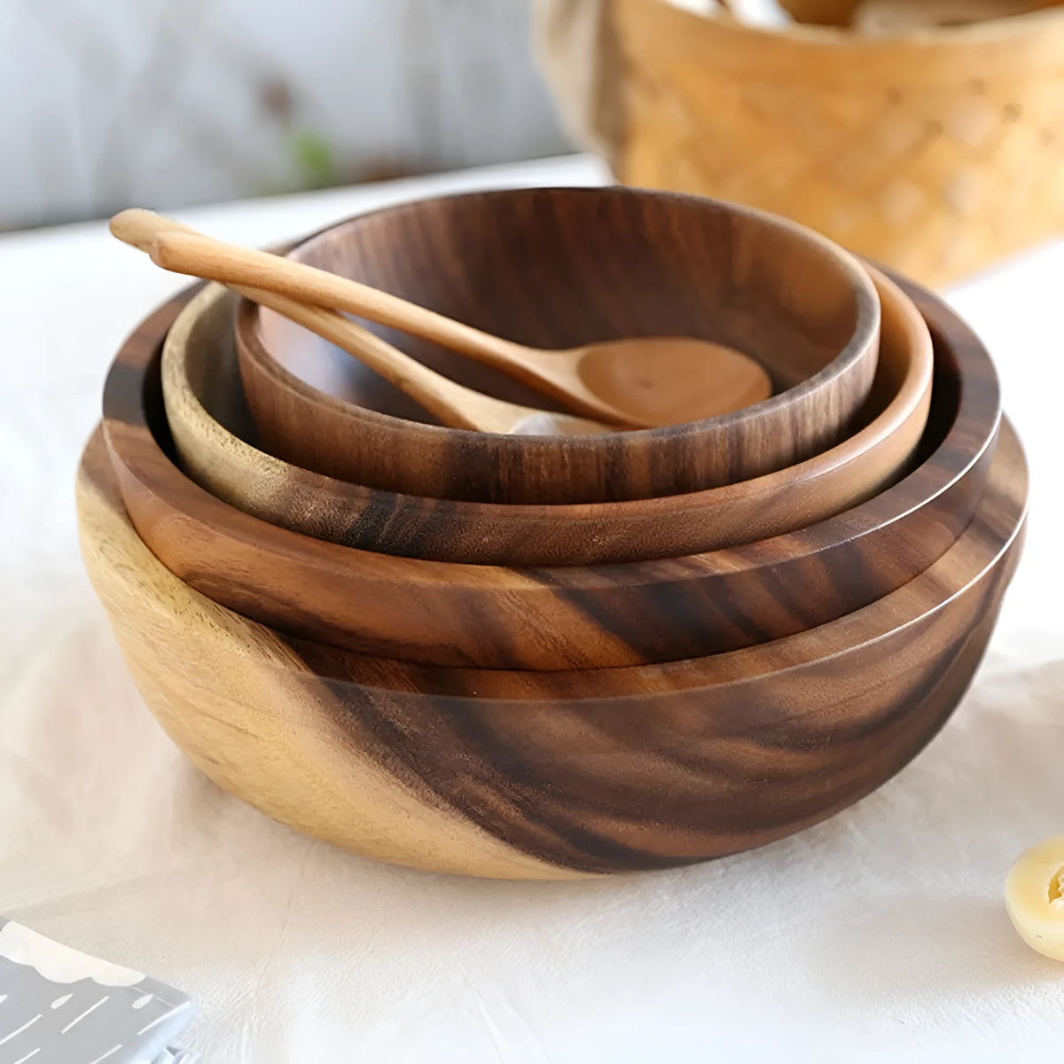 Brown handmade wooden serving bowl with natural wood grain on a table.