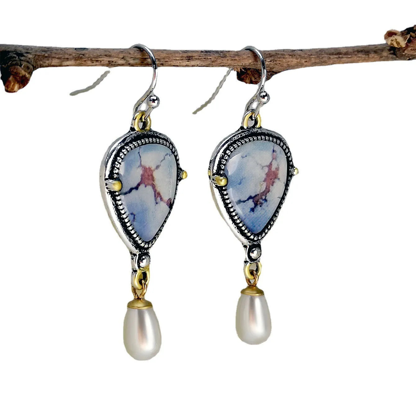 Retro blue geometric drop earrings with synthetic opal and pearl detail on a metal base.