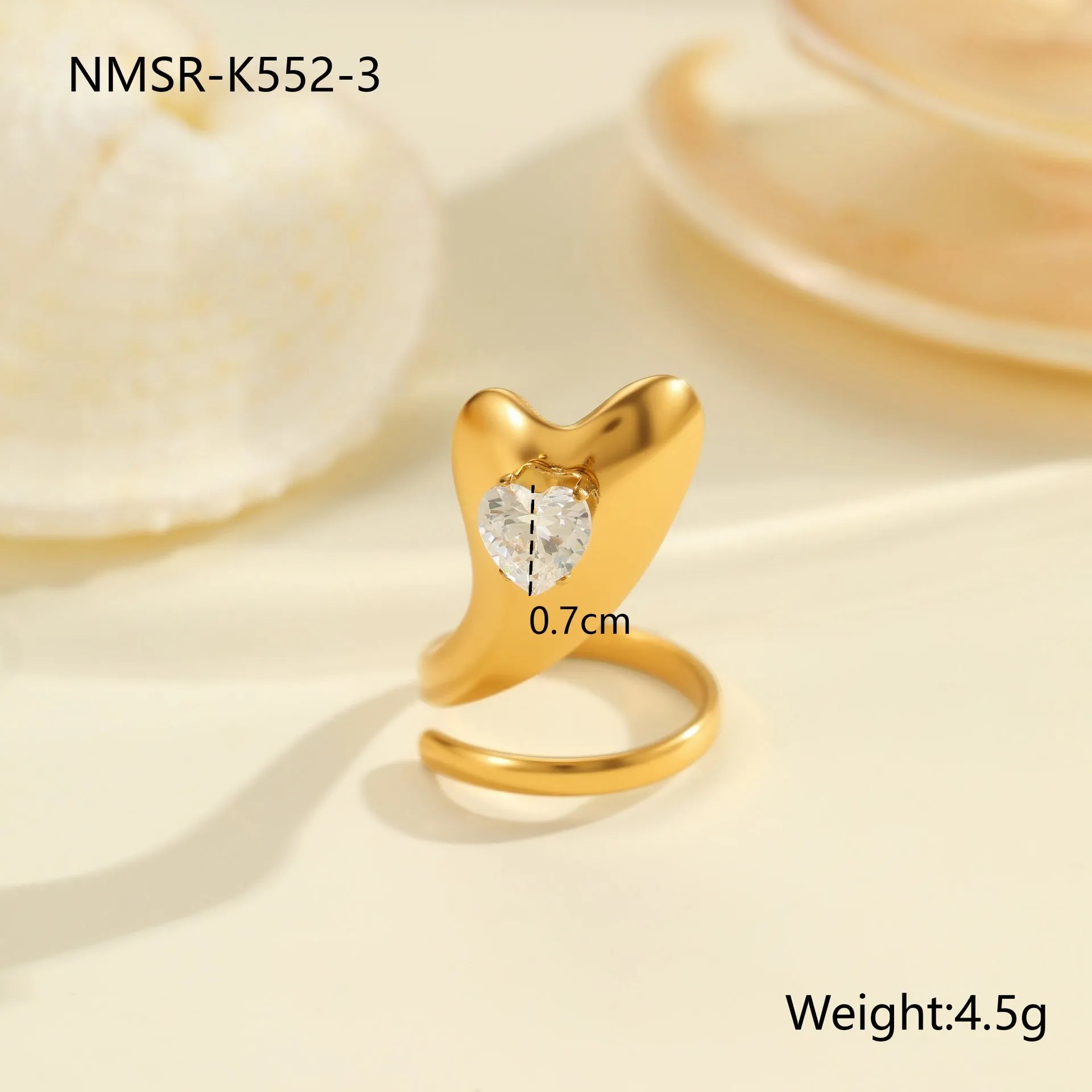 Geometric zircon ring showing round, oval and quadrangular design elements in stainless steel with electroplated finish
