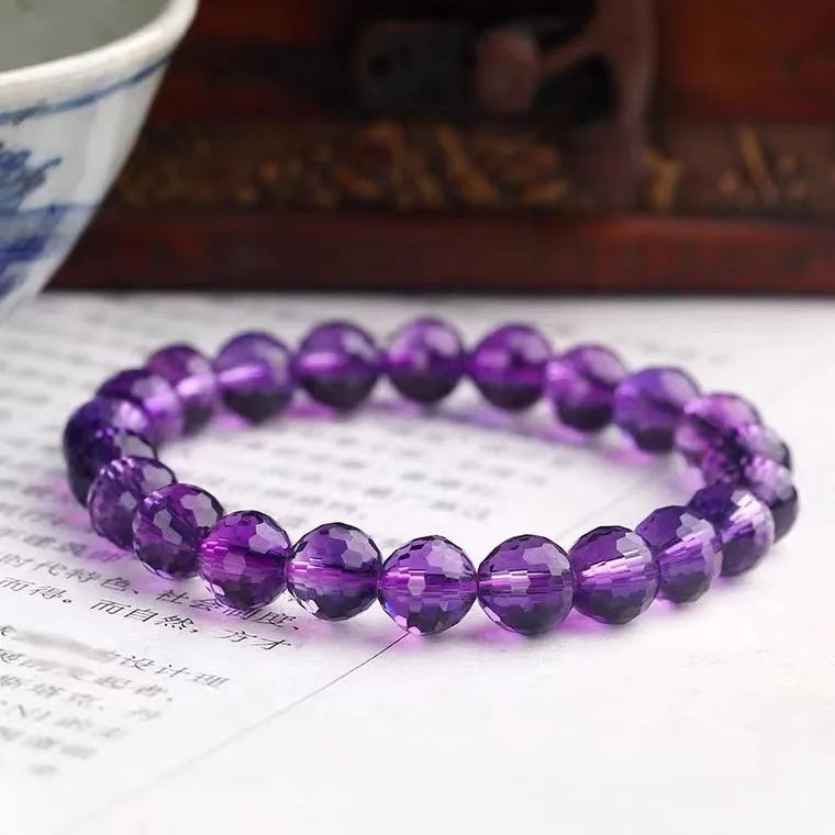 Handmade crystal bracelet with 128-cut gemstone beads and zodiac charm on wrist