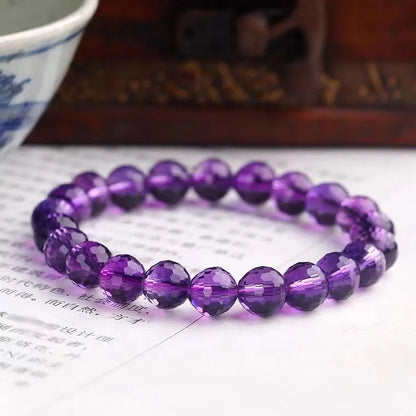 Handmade crystal bracelet with 128-cut gemstone beads and zodiac charm on wrist