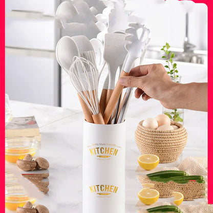 A set of silicone cooking utensils with sturdy wooden handles, designed to withstand high heat up to 446°F.