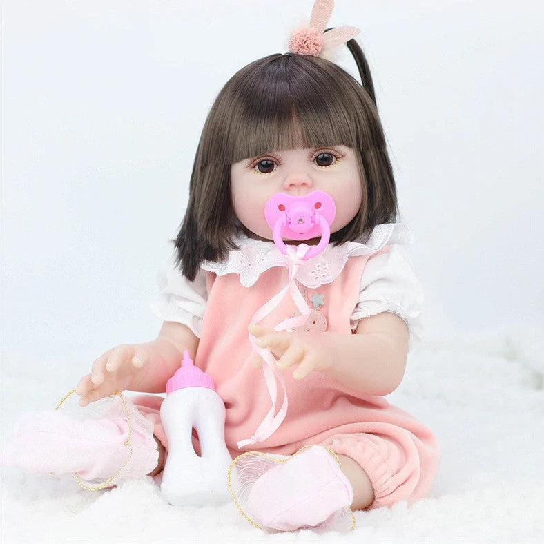 Interactive baby doll with drinking bottle showing 46cm length and 360-degree rotating limbs