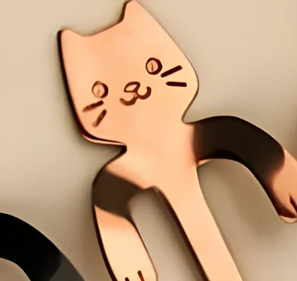 Stainless steel coffee spoon with cartoon cat handle design showing 11.7cm measurement scale