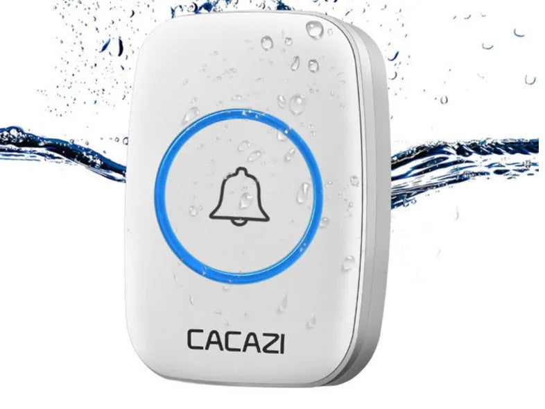 White wireless plug-in doorbell chime and black battery-powered push button on a wooden table.