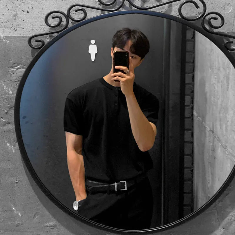 Men's slim-fit black ice silk knitted short-sleeve shirt laid flat.