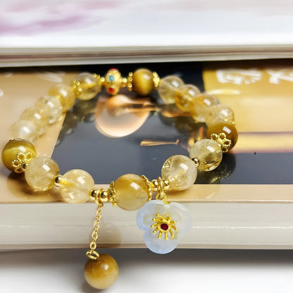 Citrine crystal bracelet with handmade flower tassel on wrist