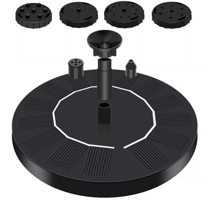 Solar-powered fountain with LED lights illuminating water stream in garden setting