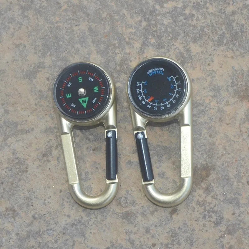 Black outdoor carabiner with a built-in circular compass and thermometer display on its side.