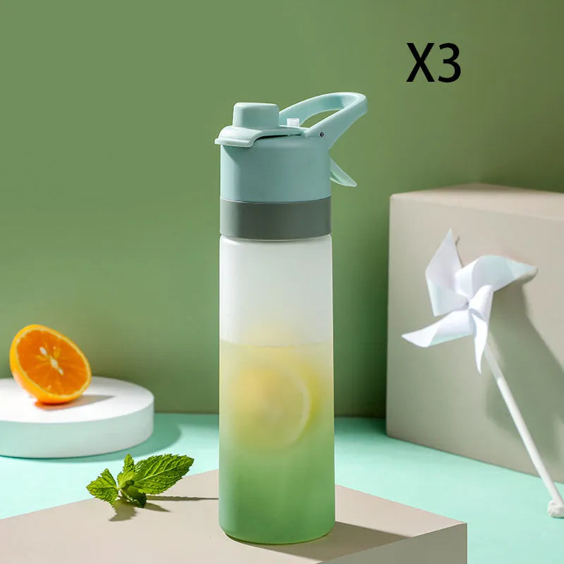Large plastic spray water bottle with handle strap and leakproof lid in green colour.