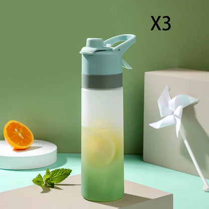 Large plastic spray water bottle with handle strap and leakproof lid in green colour.