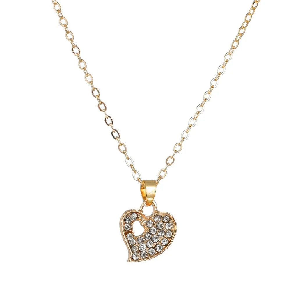 Gold-coloured women's love jewellery set with earrings, pendant and bracelet featuring bell patterns