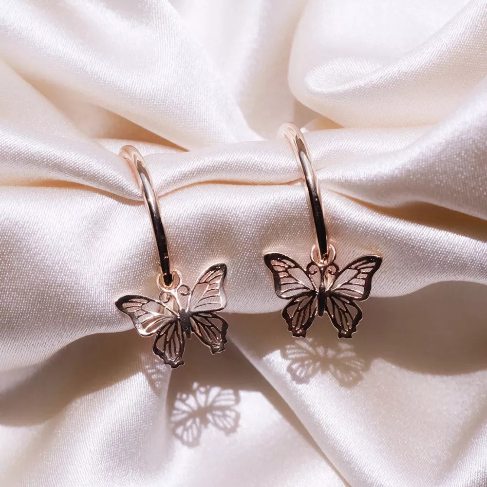 Butterfly earrings with elegant bow styling in rose gold and gold finishes