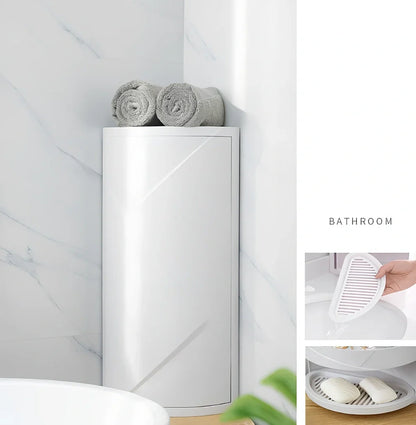 White triangle corner shelf with three tiers mounted in bathroom corner holding toiletries