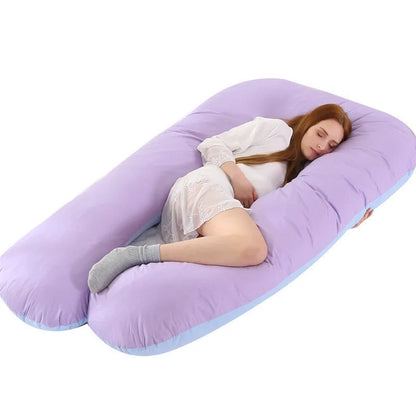 Large U-shaped pregnancy support pillow with removable cover and abdominal support belt.