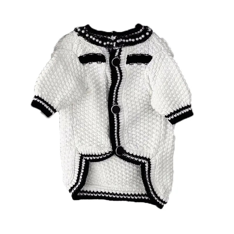 White Korean-style puppy sweater with a pearl collar on a small dog, showing the princess style design.