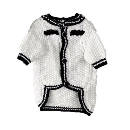 White Korean-style puppy sweater with a pearl collar on a small dog, showing the princess style design.
