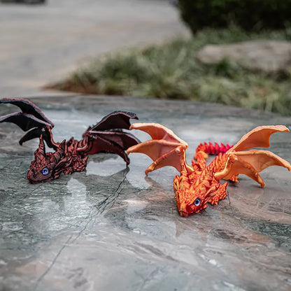 Red and gold 3D printed plastic dragon wings decoration for costumes.