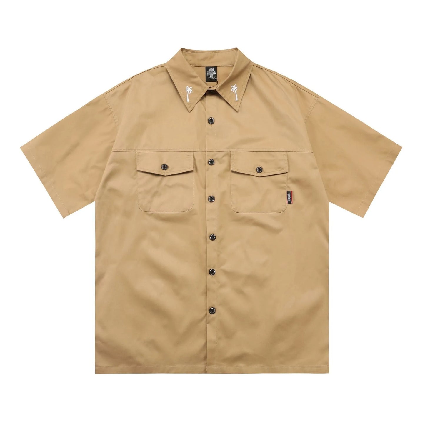 Man wearing a black cotton blend half-sleeve loose fit work shirt with embroidered detail.