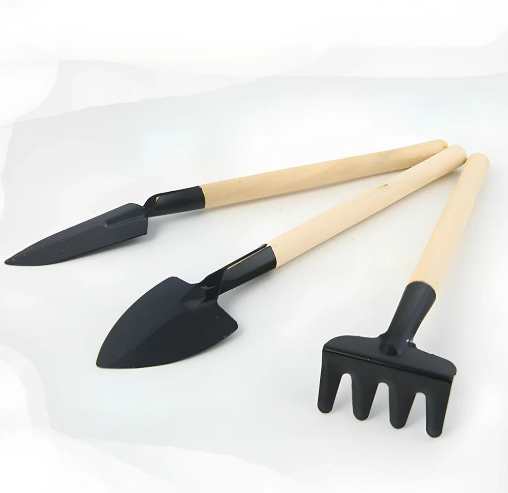 Three-piece gardening tool set showing trowel, hand fork, and weeder with carbon steel blades
