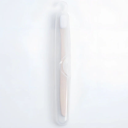Bamboo toothbrush with wood colour handle measuring 18.5cm long with soft white bristles in protective tube