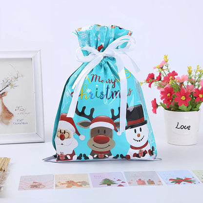 Christmas gift bag with drawstring closure in laser gold finish, 32x24cm dimensions