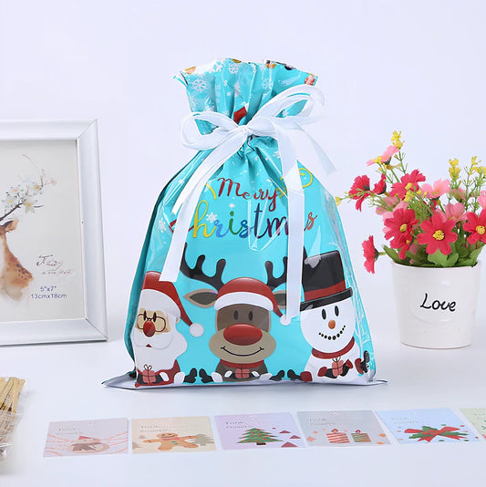 Christmas gift bag with drawstring closure in laser gold finish, 32x24cm dimensions