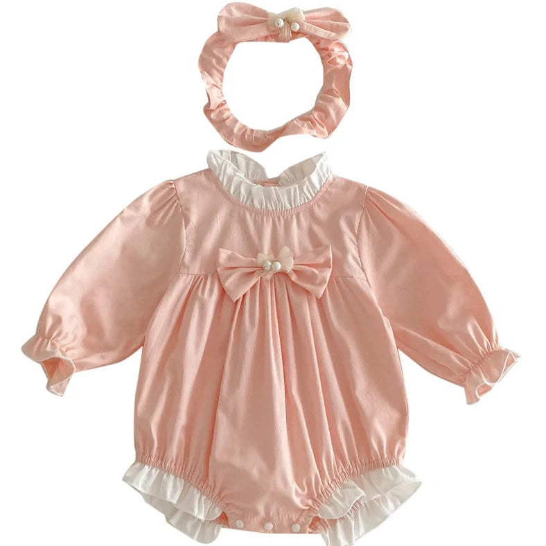 Girl wearing peach branch climbing colour triangle jumpsuit with princess dress styling and matching headband