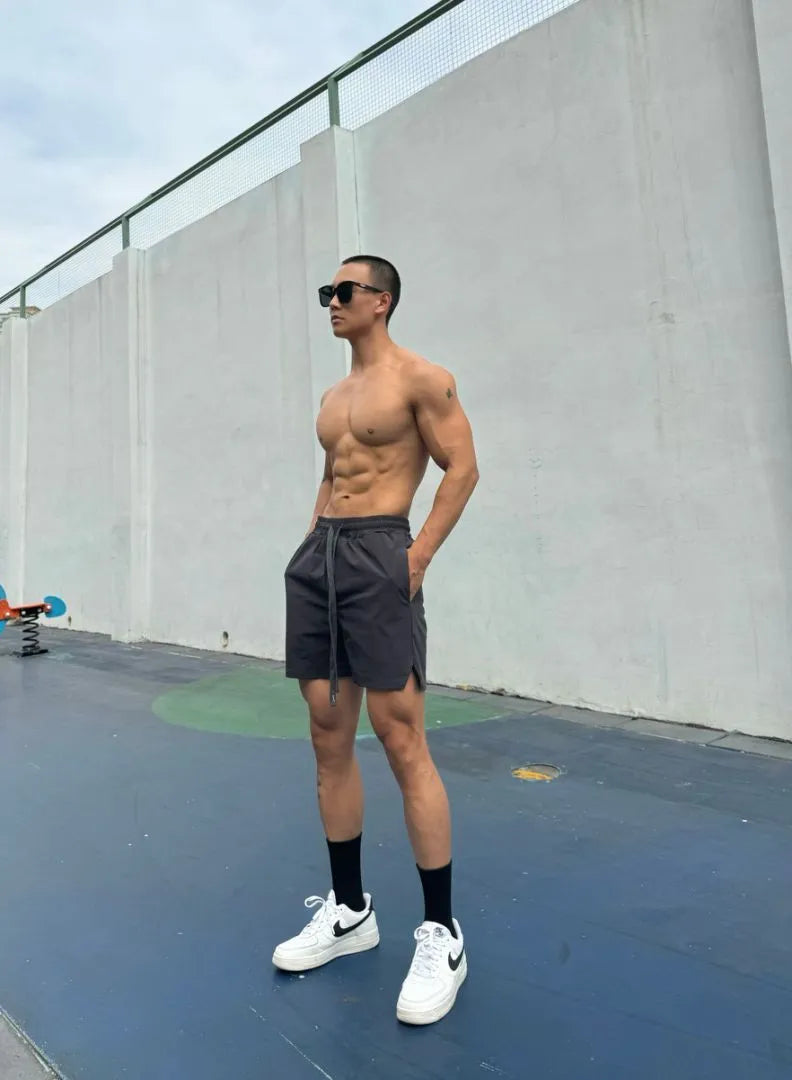 Men's ice silk quick-drying double-layer shorts in quarter-length design with nylon fabric