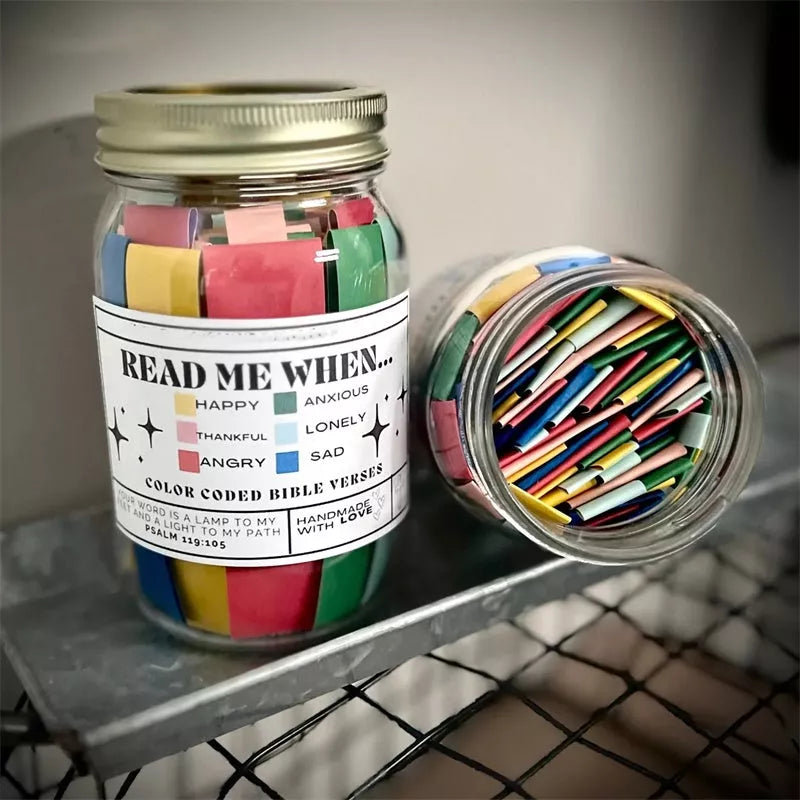 Handmade glass jar containing 67 color-coded Bible verses for emotional support
