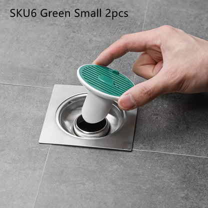Whale Magnetic Suction Floor Drain Cover in white, orange, or green, blocking sewer odors with a tight seal